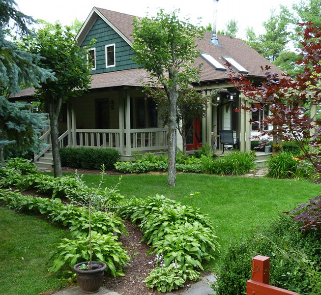 We designed this Skaneateles, New York bungalow home almost 17 years ago. A few recent photos from David reminds us how timeless architecture gets better with each year. And that you can never go wrong with a big porch!