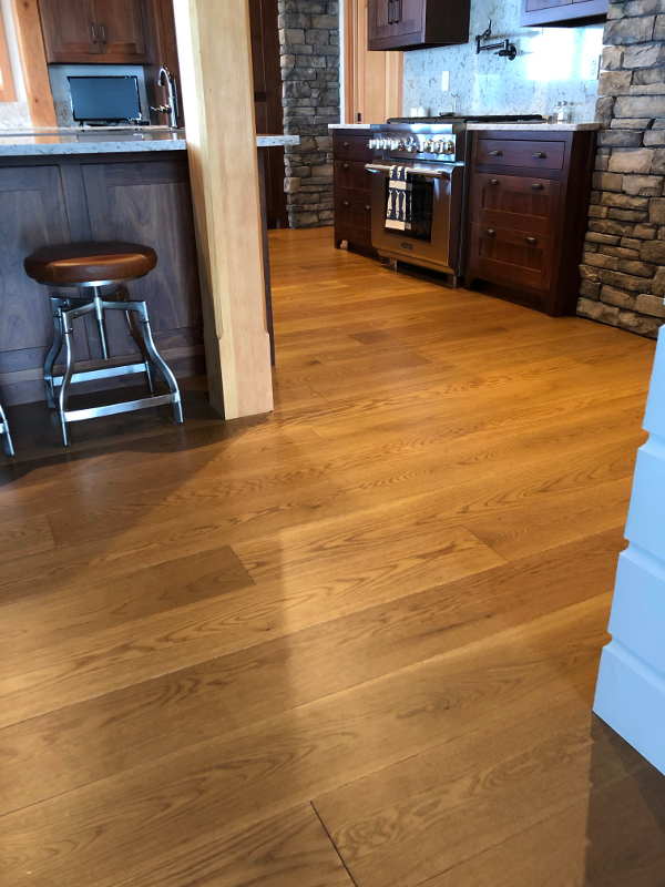 Modern Farmhouse Clean White Oak flooring in wider widths with a custom tinted UV oil finish – from our sister company, Pioneer Millworks.