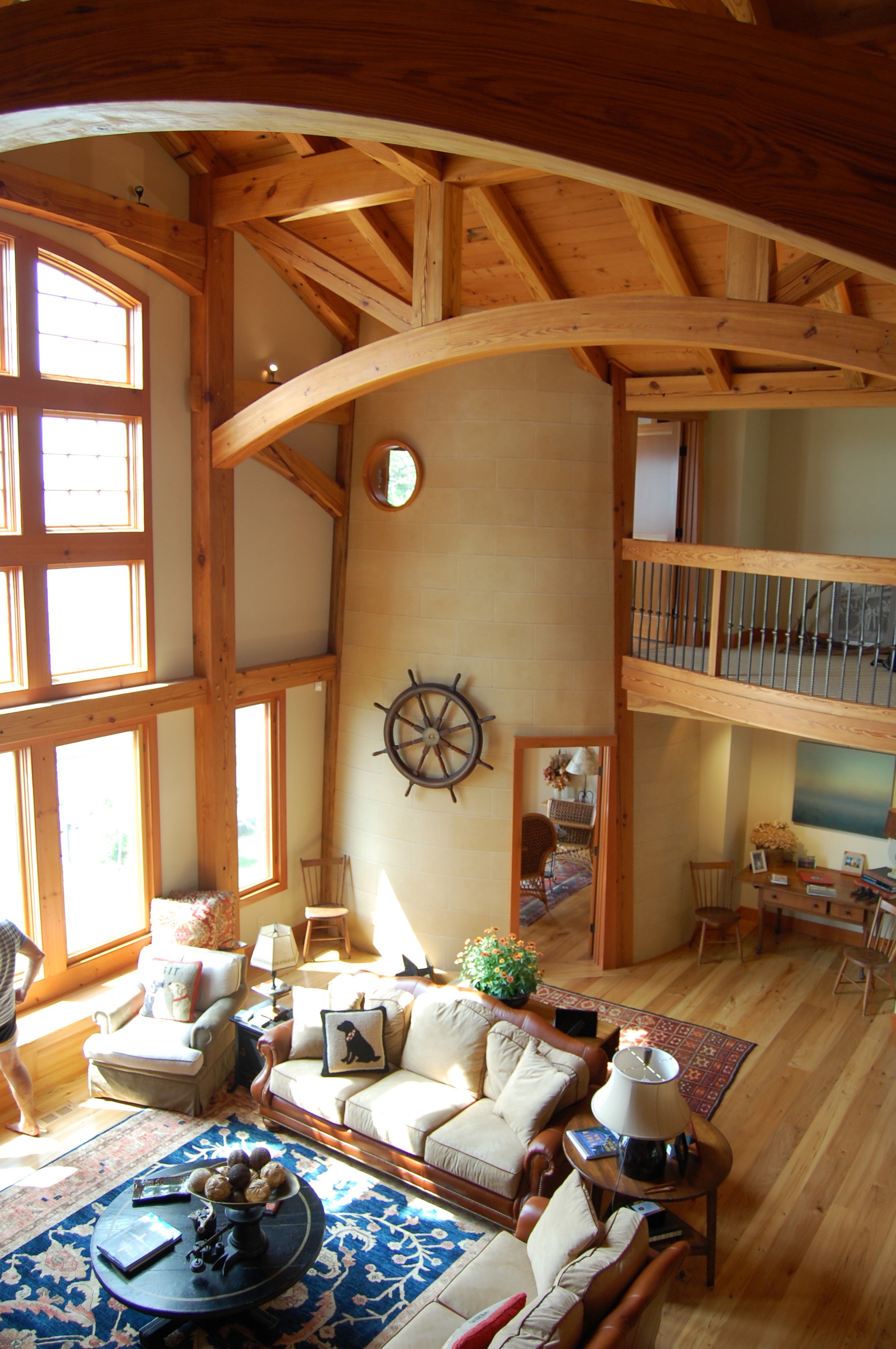 Within this timber frame home, a functioning, canted lighthouse constructed with Heart Pine timbers overlooks a large lake.