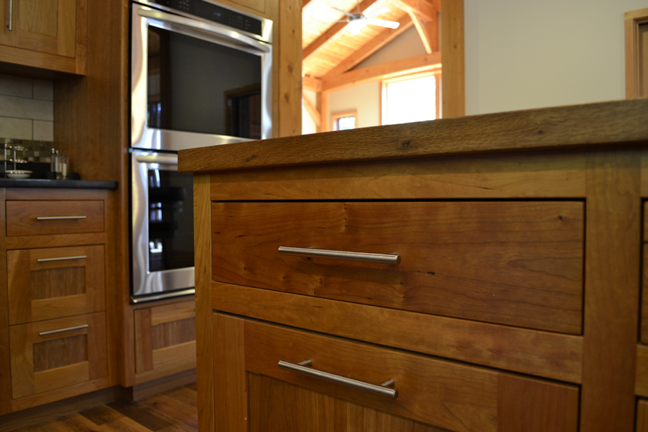 Crafted by NEWwoodworks, the cherry cabinetry will continue to deep in tone and character as it naturally ages.