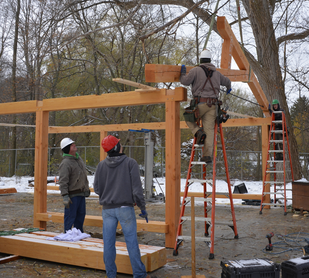Setting the first truss for the pavilion roof.