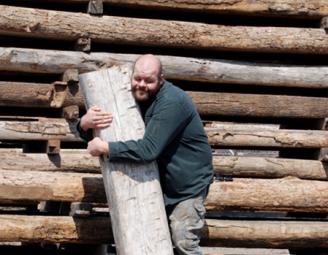 josh_hugs_reclaimed_timber_1.jpg