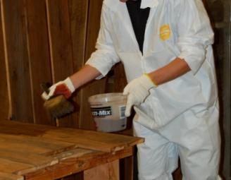 jered_applies_stain_to_reclaimed_wood.jpg