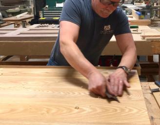 charlie_hand_scraping_joints_custom_table.jpg