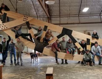 team_on_glulam_truss.jpeg