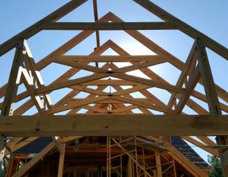timber_frame_raising_scissor_truss_with_metal_connections.jpg