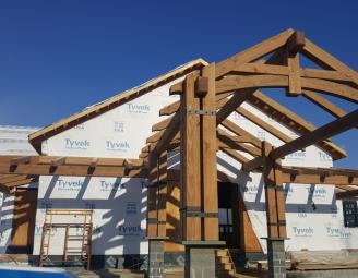 naked_timber_frame_curved_bottom_chord_king_post_truss.jpg