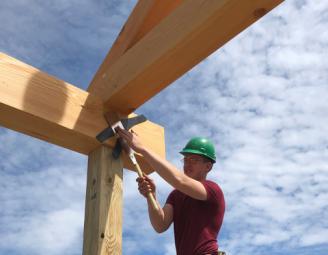 sam_trimming_peg_farmington_raising.jpg