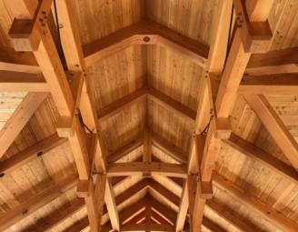 parallel_chord_timber_trusses_with_metal_pa_timber_frame_home.jpeg
