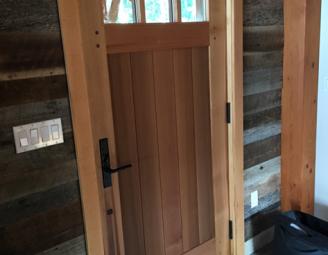 barn_siding_with_reclaimed_vat_door.jpg