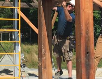 mike_at_raising_reclaimed_timber_frame.jpg