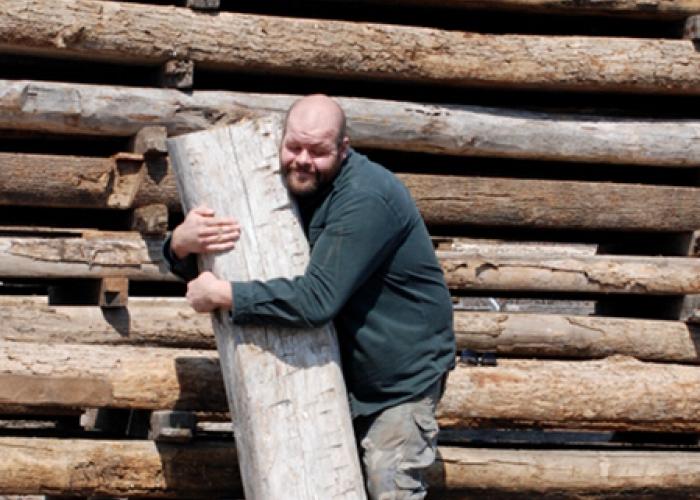 josh_hugs_reclaimed_timber_1.jpg