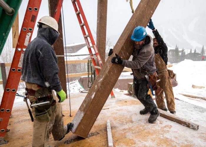 jake_lifting_timber_post_stowe_vermont.jpg