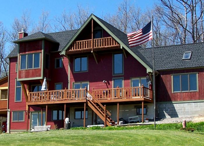 red_timberframe_with_flag.jpg