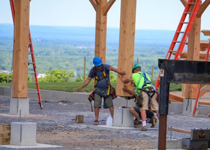 guys_putting_timber_bent_in_place.jpg