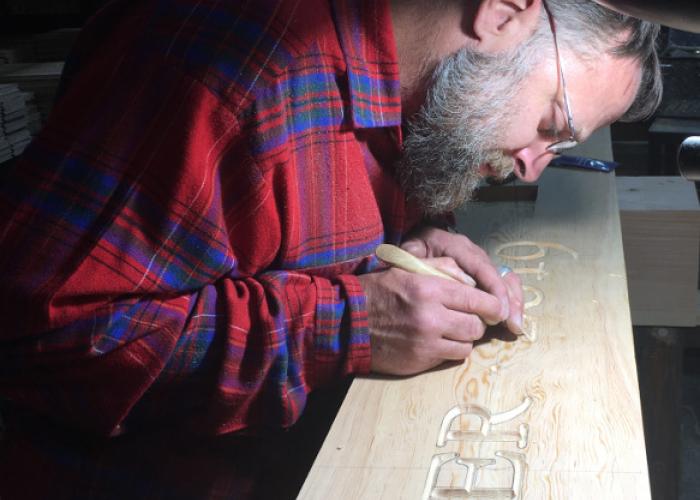 mike_w_carving_in_shop.jpg