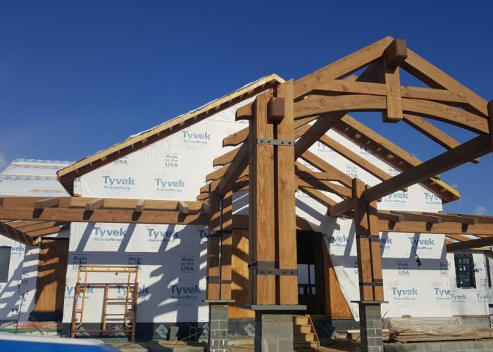 naked_timber_frame_curved_bottom_chord_king_post_truss.jpg