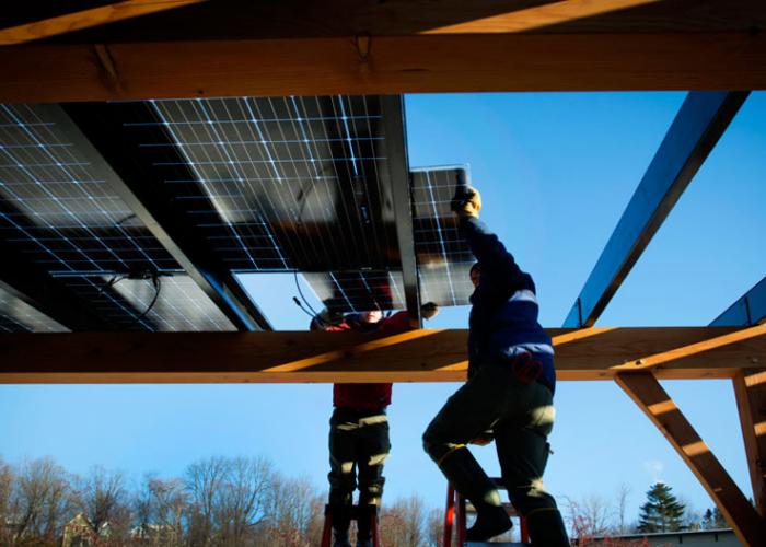 installing_solar_panel_suncommon_new_energy_works.jpg