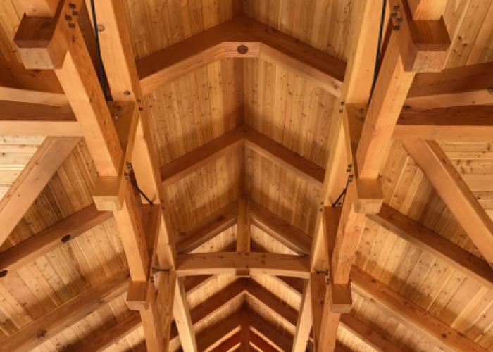 parallel_chord_timber_trusses_with_metal_pa_timber_frame_home.jpeg