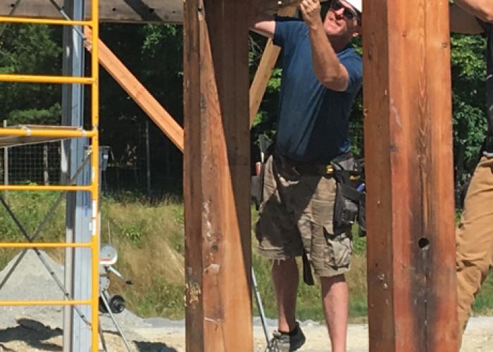 mike_at_raising_reclaimed_timber_frame.jpg