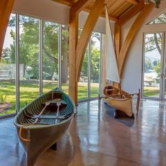 Curved glulam braces bring the impact of the timber structure down to eye-level in this historical museum.