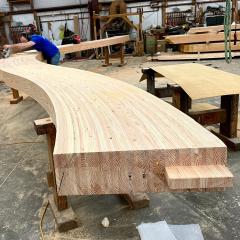 This in-progress shot shows the dramatic shapes that can be achieved in glulam beams. Part of the Acadia National Park Gateway Center.