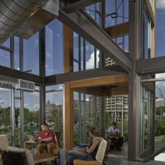 Timber elements provide a warm, naturalistic touch in this student housing at College of Environmental Science &amp; Forestry at SUNY.